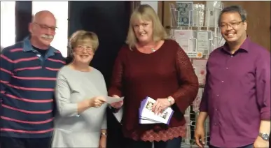  ??  ?? LEFT: Suzanne Cox from Open Door is presented with the proceeds of the Dargle Bridge Club’s charity night.