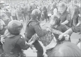  ?? Associated Press ?? Police detain a protester during a demonstrat­ion in downtown Moscow on Monday.