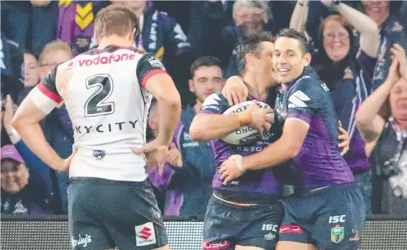  ?? Picture: GETTY IMAGES ?? Melbourne halfback Cooper Cronk celebrates with good mate Billy Slater after scoring a try in the win over the Warriors,