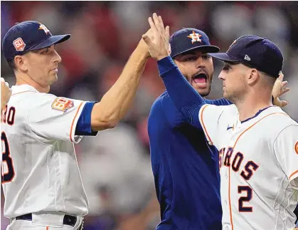  ?? DAVID J. PHILLIP/ASSOCIATED PRESS ?? Houston’s Alex Bregman (2), celebrates with teammates Jason Castro, left, and Lance McCullers Jr. after Thursday’s 2-1 win over the visiting New York Yankees, who were in town for just one game.