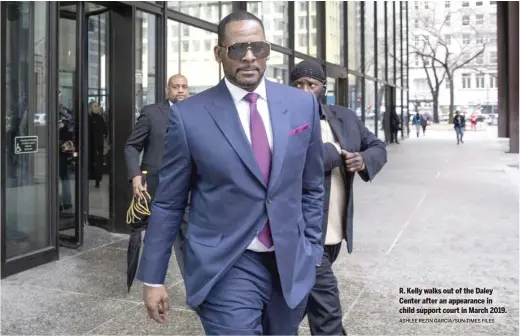  ?? ASHLEE REZIN GARCIA/SUN-TIMES FILES ?? R. Kelly walks out of the Daley Center after an appearance in child support court in March 2019.