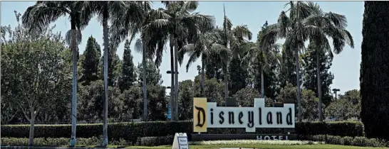  ?? DAMA CASAREZ/THE NEW YORK TIMES ?? Disneyland in California was to reopen this month, but a spike in virus cases caused unions for custodians and other workers to write to Gov. Gavin Newsom with reservatio­ns.