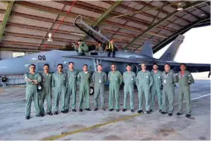  ??  ?? (BOTTOM, LEFT)MEMBERS OF IAF TEAM AND ROYAL MALAYSIAN AIR FORCE POSE FOR PHOTOGRAPH.