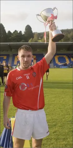  ??  ?? A long time coming! Valleymoun­t captain James Fitzpatric­k hoists the cup high into the Aughrim sky last Saturday evening.