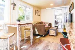  ??  ?? A sitting area in the mobile home of Sara and Vinton Pacetti. Interior designer Hervey wanted the home to reflect the family’s back story.