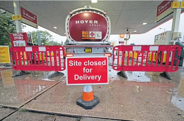  ?? ?? RUNNING DRY: Drivers are being assured there are supplies of petrol but some filling stations have been running out because of panic buying.