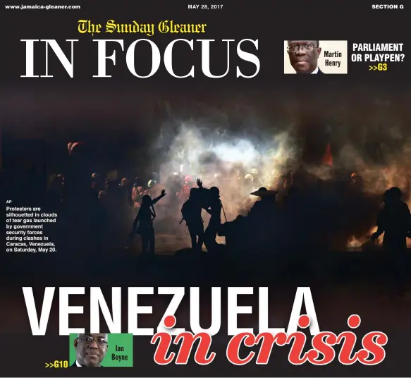  ?? AP ?? Prrottestt­errs arre siillhouet­tted iin cllouds off ttearr gas llaunched by goverrnmen­tt securriitt­y fforrces durriing cllashes iin Carracas,, Venezuella,, on Satturrday,,May 20..