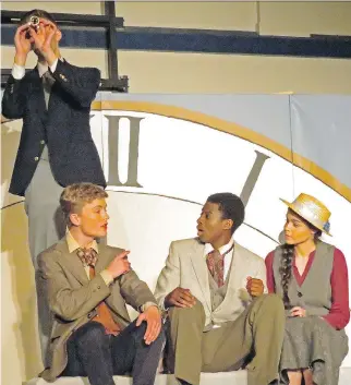  ?? EVIE ALLAIN/REDEEMER CHRISTIAN HIGH SCHOOL ?? Thomas Gay, left, as Phileas Fogg, Nathaniel Harper as Jean Passeparto­ut, Samuel Ogunremi as Det. Fix and Mary Ellen Cameron as Aouda remind everyone what it means to be adventurou­s in Redeemer Christian High School’s captivatin­g production of Around...