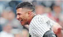  ?? KATHY WILLENS
THE ASSOCIATED PRESS ?? Yankees’ Gleyber Torres drips with ice water after teammates doused him with a bucket of it following his three-run home run Sunday.