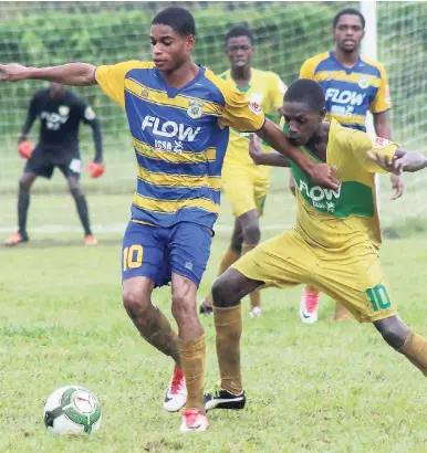  ?? FILE ?? Rusea’s High’s Nazime Matalie (left) shields the ball from Knockalva High’s Rushean Henderson during a recent ISSA/FLOW daCosta Cup match.