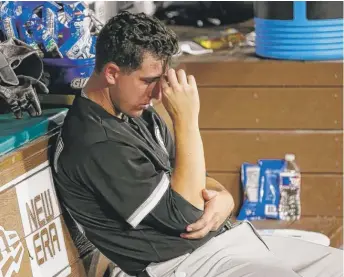  ??  ?? Sox starter Derek Holland is the picture of frustratio­n after being yanked in the third inning. | ROGER STEINMAN/ AP