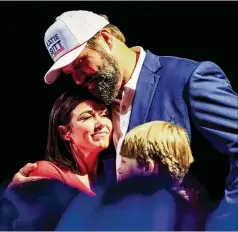  ?? BUTCH DILL/ASSOCIATED PRESS ?? Republican U.S. Senate candidate Katie Britt hugs her husband, Wesley Britt, as she speaks to supporters in Montgomery, Ala., after securing the nomination during a runoff against Mo Brooks.