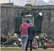  ?? GETTY ?? Legacy: families at the shrine on a mass burial site in Tuam