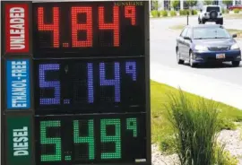  ?? AP PHOTO/RICK BOWMER ?? Gasoline prices are seen at a gas station Thursday in Salt Lake City.