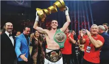  ?? Reuters ?? Callum Smith lifts the Muhammad Ali Trophy after beating George Grovesin Jeddah, Saudi Arabia, on Friday.