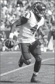  ?? File Photo/AP ?? Texans quarterbac­k Deshaun Watson scrambles Sept. 24 against the Patriots in Foxborough, Mass.