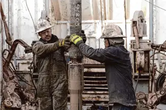  ?? Ellen Schmidt/Associated Press ?? Rig operators access heat reservoirs last November near Milford, Utah. In Nevada, Fervo Energy’s first operationa­l geothermal project has begun producing carbon-free electricit­y.