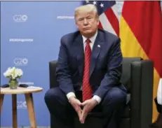  ?? AP PHOTO/ PABLO MARTINEZ MONSIVAIS ?? President Donald Trump listens to questions from members of the media during his meeting with Germany’s Chancellor Angela Merkel at the G20 Summit on Saturday in Buenos Aires, Argentina.