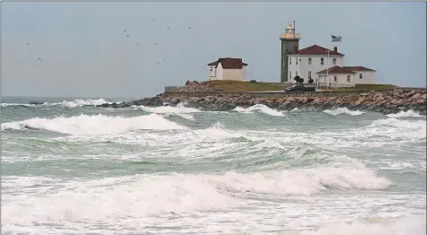  ?? DANA JENSEN/THE DAY FILE PHOTO ?? Watch Hill Lighthouse overlooks strong waves rolling toward the shore of East Beach on Nov. 16, 2017, in the Watch Hill section of Westerly.