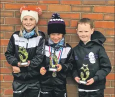  ??  ?? Ruby Wright, Grace Popplewell and Luke Goatley with their trophies.