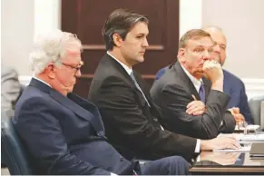  ?? The Post And Courier via AP, Pool ?? Defense attorneys Andy Savage, left, and Don McCune and Miller Shealy, right, sit around former North Charleston police officer Michael Slager on Dec. 5, 2016, at the Charleston County court in Charleston, S.C.