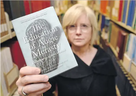  ?? TROY FLEECE ?? Colleen Murphy of the Saskatchew­an Library Associatio­n encourages people to read The Education of Augie Merasty: A Residentia­l School Memoir written by Auguste Merasty with David Carpenter to learn more about an important chapter of Canadian history.