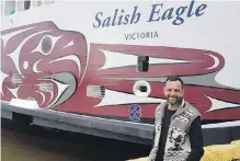  ?? B.C. FERRY SERVICES ?? Stz’uminus First Nation’s John Marston unveils his artistic design on the hull of Salish Eagle in April 2017.