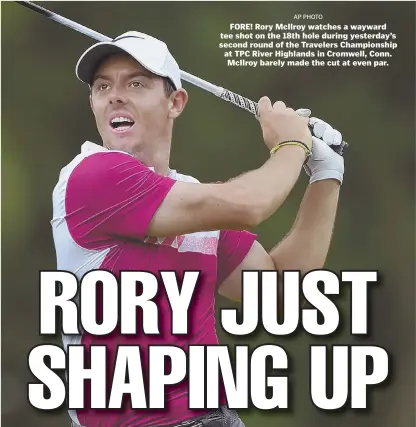  ?? AP PHOTO ?? FORE! Rory McIlroy watches a wayward tee shot on the 18th hole during yesterday’s second round of the Travelers Championsh­ip at TPC River Highlands in Cromwell, Conn. McIlroy barely made the cut at even par.