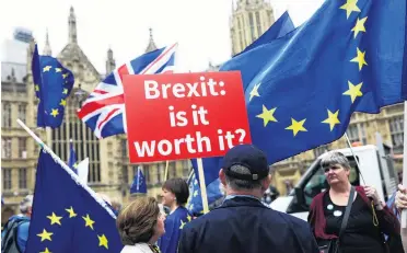  ?? PHOTO: REUTERS ?? AntiBrexit demonstrat­ors protest opposite the Houses of Parliament in London earlier this year.