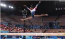  ?? Laine/Getty Images ?? Simone Biles during her beam routine on Tuesday in Tokyo. Photograph: Xavier