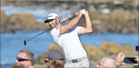  ??  ?? Dustin Johnson follows his shot from the 13th tee of the Monterey Peninsula Country Club Shore Course during the second round of the AT&T Pebble Beach National Pro-Am.