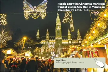  ?? Photo: IC ?? People enjoy the Christmas market in front of Vienna City Hall in Vienna on December 17, 2018.