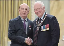  ?? CANADIAN PRESS FILE PHOTO ?? Play-by-play great Bob Cole is set to return to the hockey broadcast booth for one last season. Governor General David Johnston is seen with Cole in 2016 as Cole was invested as a Member of the Order of Canada.