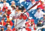  ?? AP PHOTO/PATRICK SEMANSKY ?? The Atlanta Braves’ Josh Donaldson watches his solo home run in the 10th inning of Wednesday’s game against the Nationals in Washington. Atlanta won 5-4.