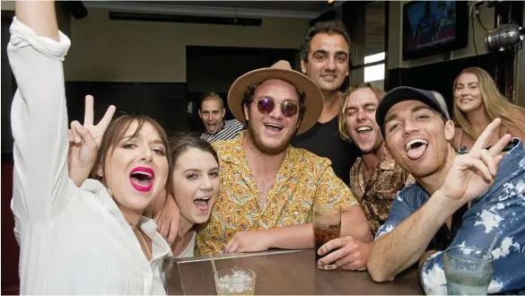  ?? PHOTOS: NEV MADSEN ?? COUNTING DOWN: Celebratin­g Triple J’s Hottest 100 at the Spotted Cow are (front, from left) Jenna Weber, Amy Whitley, Bayley Owers, Phil Coorey, Tom Fletcher and Trent Owers, with (back, from left) Cameron Wilkins and Sarah-Jane Callaghan.