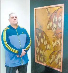  ?? Photo / Rachel Canning ?? Pyrographi­c artist Wayne Hansen photograph­ed next to his work which is part of the exhibition a protest on 1080, P and a celebratio­n of spirit.