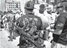  ?? SMILEY N. POOL/THE DALLAS MORNING NEWS VIA AP ?? Gun rights advocates demonstrat­e outside Dallas City Hall at a rally organized by Open Carry Texas during the NRA’s annual meeting.