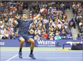  ?? Adam Hunger / Associated Press ?? Novak Djokovic celebrates after defeating Juan Martin del Potro in the men’s final of the U.S. Open on Sunday.