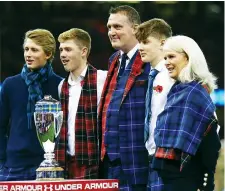  ??  ?? Standing tall: Doddie Weir on the pitch with wife and family