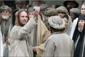  ?? MATTHIAS SCHRADER — THE ASSOCIATED PRESS ?? Frederik Mayet as Jesus performs May 4during the rehearsal of the 42nd Passion Play in Oberammerg­au, Germany. More than 1800citize­ns of this Bavarian village participat­e in the century-old play of the suffering of Christ, staged every ten years and dating back to 1634. The village had taken a vow then to escape the plague that had threatened the population.