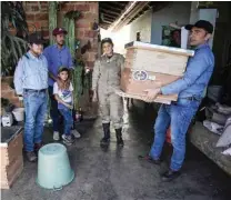  ?? ?? Perilla hands Acevedo hives made from illegal timber.