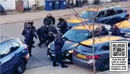  ?? ?? Arrest drama: Armed police pull the suspect from his car and pin him to the ground in Childs Hill, north London