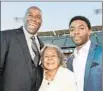  ??  ?? MAGIC JOHNSON, left, Rachel Robinson and actor Chadwick Boseman.