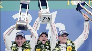  ?? PICTURE: REUTERS ?? Celebratin­g their Le Mans 24-Hour victory are Earl Bamber (centre), Nick Tandy (left) and Nico Hülkenberg. It was the 83rd running of the world’s most famous endurance race, and is the premier event of the FIA World Endurance Championsh­ip.