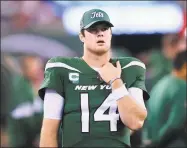  ?? Bill Kostroun / Associated Press ?? Jets quarterbac­k Sam Darnold walks the sideline during the second half of Monday’s loss to the Patriots.