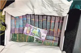  ?? NEW ZEALAND POLICE VIA AP ?? A box containing cash was found in raid as part of Operation Trojan Shield. Authoritie­s in Australia and New Zealand say hundreds of criminals were tricked into using a messaging app run by the FBI.
