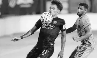  ?? STEPHEN M. DOWELL/ORLANDO SENTINEL ?? Orlando City’s Junior Urso (11) controls the ball against New York City FC during the MLS is Back Tournament at ESPN Wide World of Sports.