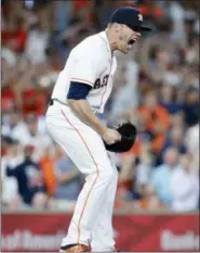  ?? MICHAEL WYKE — THE ASSOCIATED PRESS ?? Closer Ken Giles reacts after striking out Yankees’ Aaron Hicks to end a game in Astros’ 2-1 win.