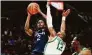  ?? Craig Mitchelldy­er / Associated Press ?? UConn’s Tristen Newton, left, shoots against Oregon forward Quincy Guerrier on Thursday.