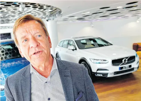  ?? JONAS EKSTROMER / AFP / GETTY IMAGES ?? Volvo Cars chief executive Hakan Samuelsson speaks at a showroom in Stockholm, Sweden. He says all Volvo cars will be electric or hybrid within two years, but David Booth points out that may not be as revolution­ary as it seems.